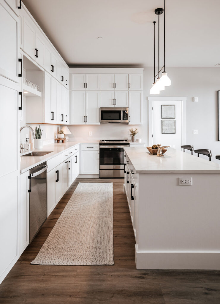 Open-concept living and kitchen area in a 1 bedroom apartment at The Pearl near downtown Fort Wayne