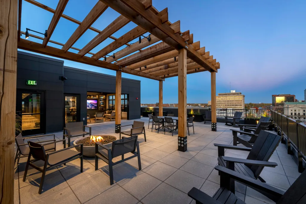 Rooftop firepit and gathering space overlooking downtown Fort Wayne at The Pearl